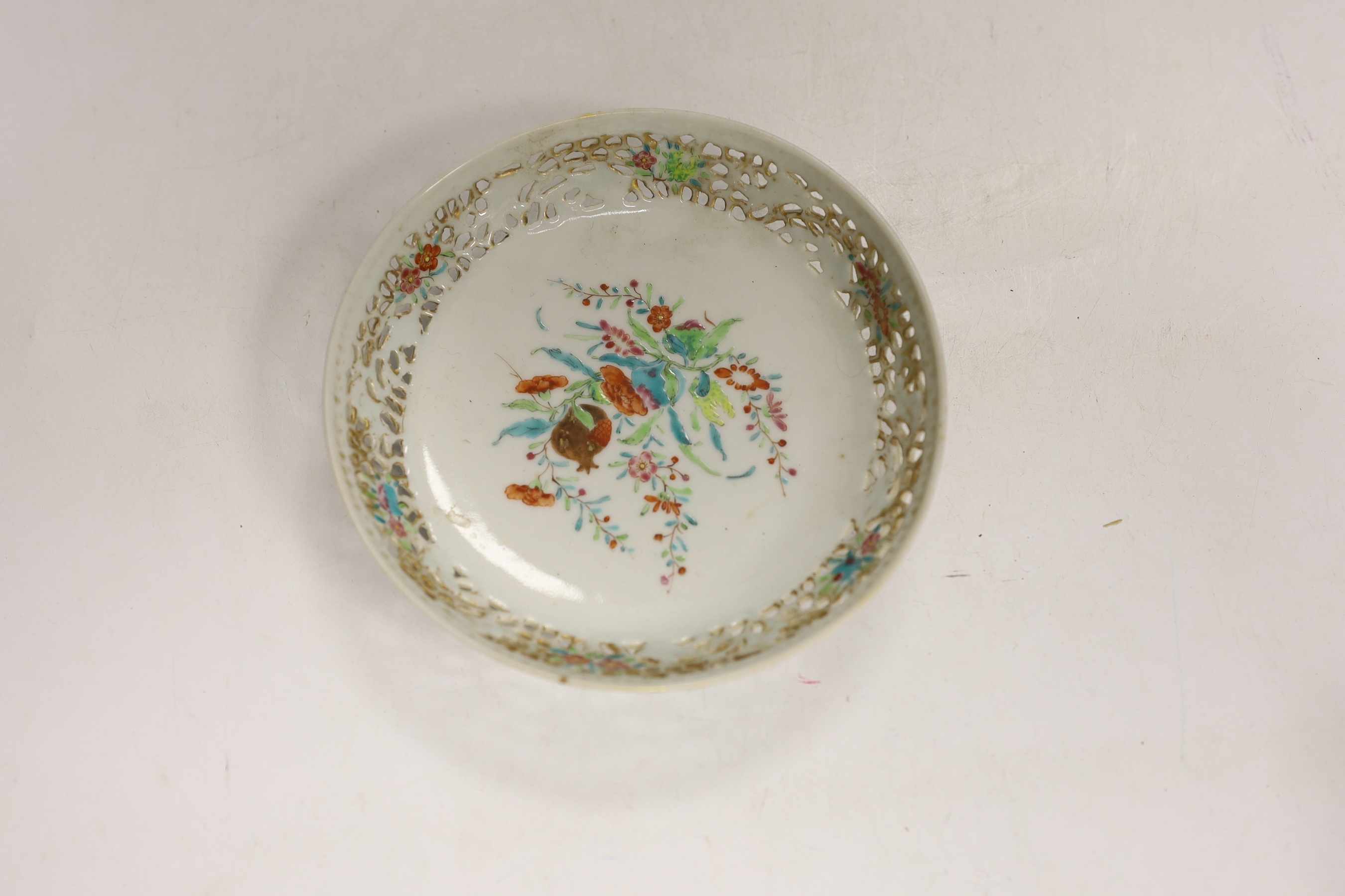 A Chinese 18th century reticulated double walled tea bowl and saucer, two blue and white plates and a jug (5)